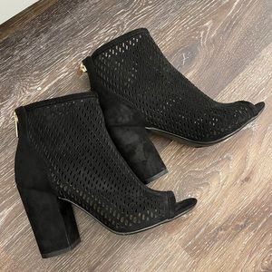 Gently worn, open-toed ankle booties.
